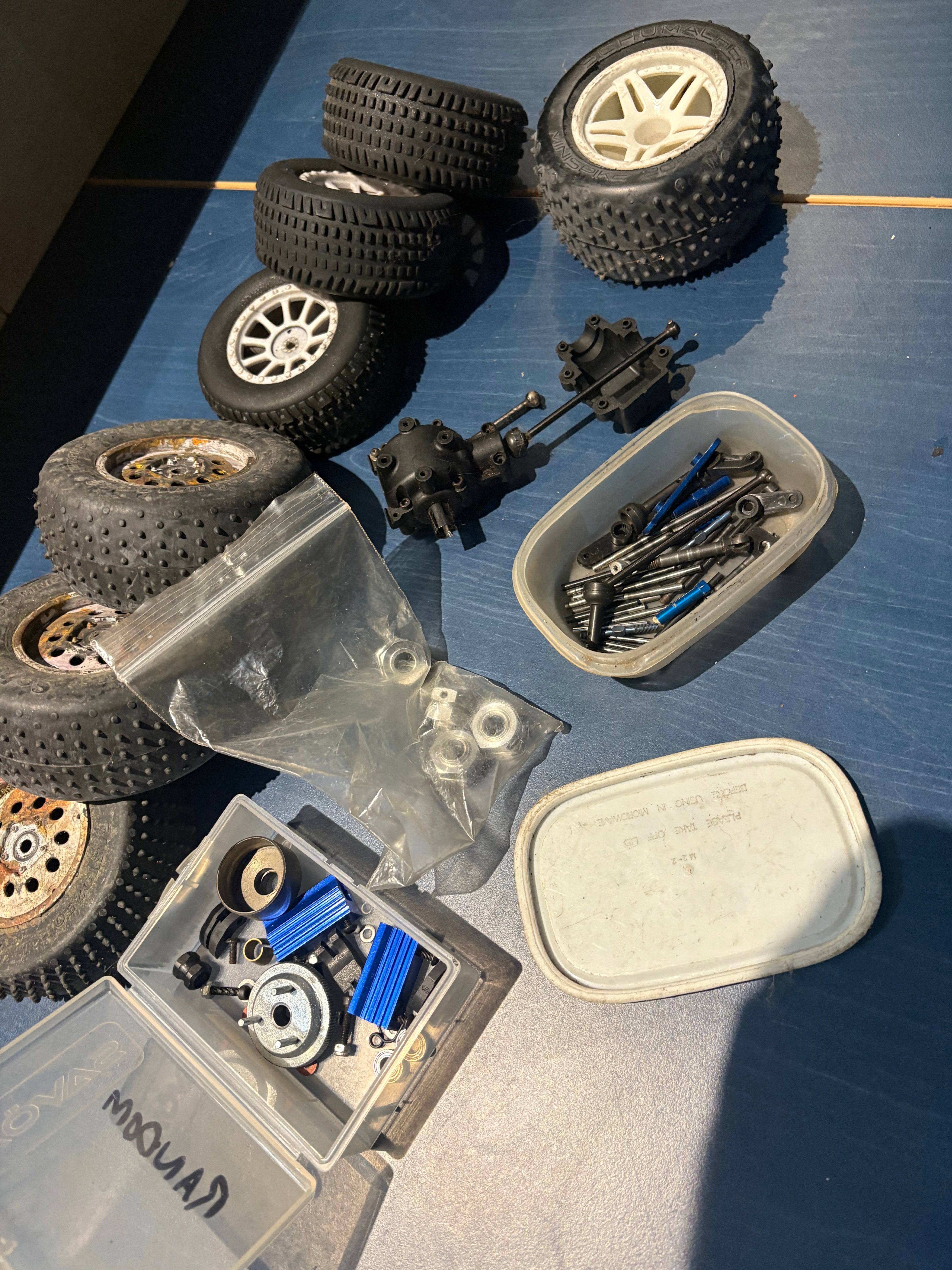Used - job lot of spares, wheels, drive shaft, sus pins, diff, nitro engine flywheel etc