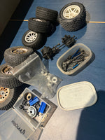 Used - job lot of spares, wheels, drive shaft, sus pins, diff, nitro engine flywheel etc