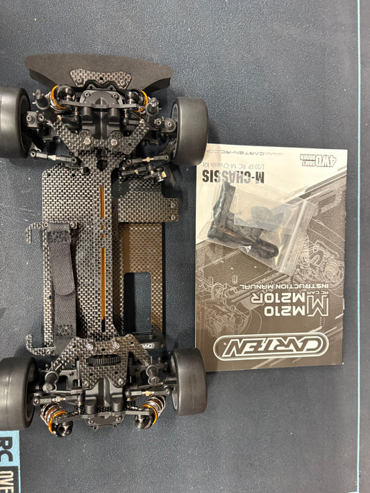 (Ex-demo) Carten - M210R 1/10 Racing Grade Carbon Fibre M-CHASSIS (210mm Mini wheelbase) KIT Form - (Requires all electrics, & body etc) (extra fitted parts - Fully alloy suspension carriers and steering rack) (this is a driven once model for demo)