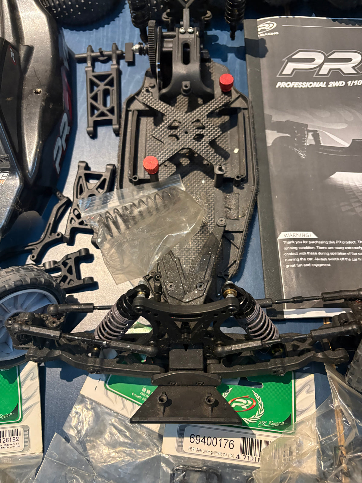 Used - 3x PR Racing S1 1/10 Buggies + spare parts (for spares or repairs)